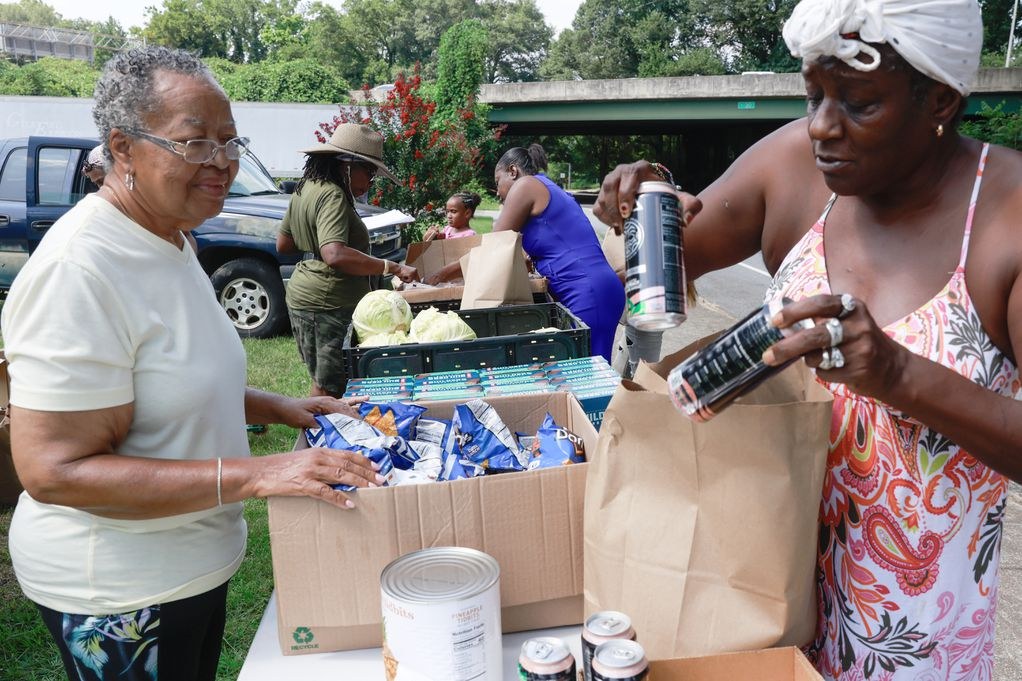 Neighbors receiving fresh food at a community distribution
